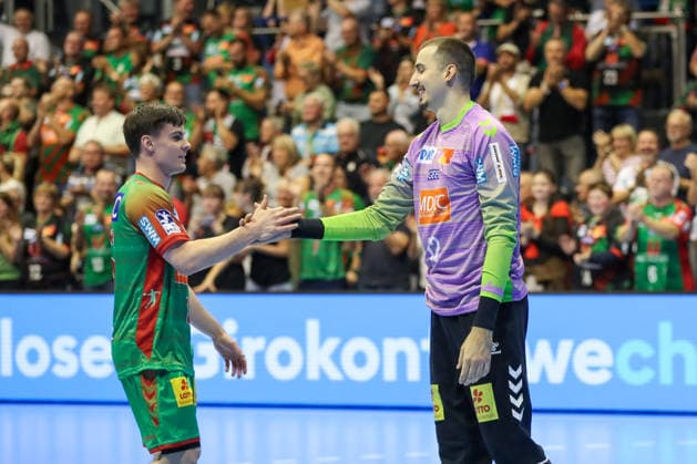 September 23, 2026, xgox, Handball DHB Cup, Round 2: SC Magdeburg vs. HSG Wetzlar (emspor), from left: Tim Thielicke (Magdeburg), 8; Matej Mandic (Magdeburg), 12, celebrating a saved shot; blocked, saved; Magdeburg goalkeeper