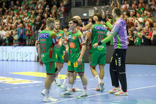 September 23, 2026, xgox, Handball DHB Cup, Round 2: SC Magdeburg vs. HSG Wetzlar (emspor), from left: Magdeburg celebrating the victory, Magdeburg celebrating after the game