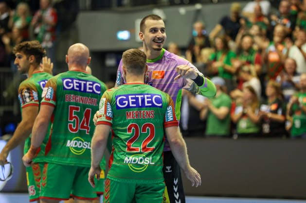 September 23, 2026, xgox, Handball DHB Cup, 2nd Round: SC Magdeburg vs. HSG Wetzlar, emspor; from left: Lukas Mertens (Magdeburg), 22; Matej Mandic (Magdeburg), 12; celebrating the victory, Celebrations after the game in Magdeburg