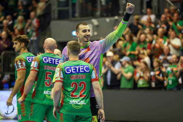 September 23, 2026, xgox, Handball DHB Cup, 2nd Round: SC Magdeburg vs. HSG Wetzlar, emspor; from left: Lukas Mertens (Magdeburg), 22; Matej Mandic (Magdeburg), 12; celebrating the victory, Celebrations after the game in Magdeburg