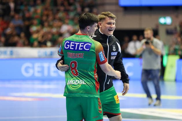September 23, 2026, xgox, Handball DHB Cup, 2nd Round: SC Magdeburg vs. HSG Wetzlar emspor; from left: Tim Thielicke (Magdeburg), 8; Malte Elze (Magdeburg), 4; celebrating the victory; Celebrations after the game in Magdeburg