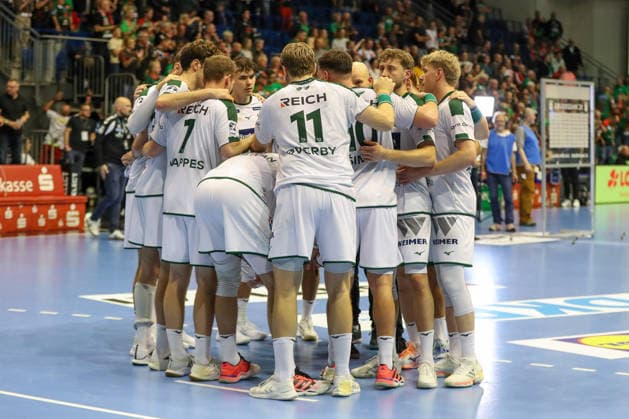September 23, 2026, xgox, Handball DHB Cup, Round 2: SC Magdeburg vs. HSG Wetzlar, emspor; from left: Wetzlar players look disappointed, dejected, and downcast; Magdeburg players look disappointed