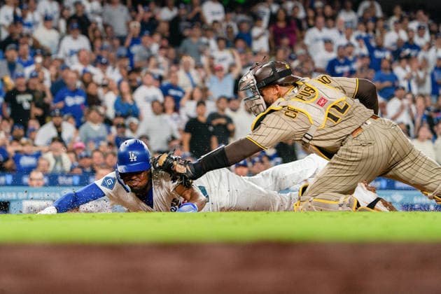September 24, 2026, Los Angeles, California, USA: Josue De Paula 95 of the Los Angeles Dodgers is tagged out at home plate by San Diego Padres during a regular-season MLB, Baseball Herren, USA game on Thursday September 24, 2026 at Dodger Stadium in Los Angeles, California.Dodgers defeat Padres, 7-0. ENRIQUE GURROLA BNS PI Dodgers Defeat Padres, 7-0  - ZUMAp124 20260924_zaa_p124_034 Copyright: xEnriquexGurrolax