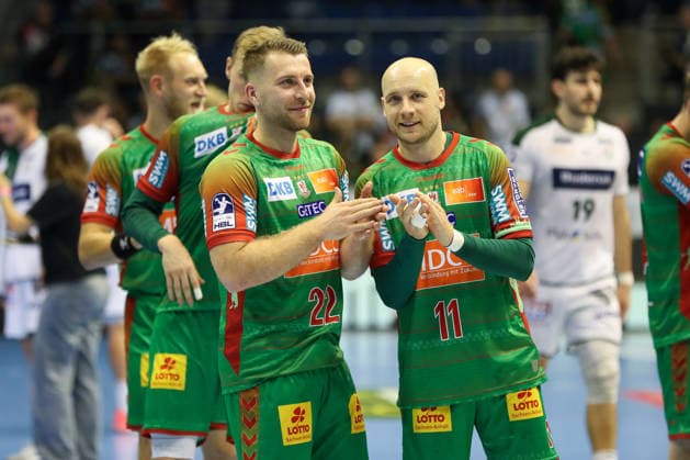 September 23, 2026, xgox, DHB Handball Cup, 2nd Round: SC Magdeburg vs. HSG Wetzlar emspor; from left: Lukas Mertens (Magdeburg), 22; Daniel Pettersson (Magdeburg), 11; celebrating the victory, Celebrations after the game in Magdeburg