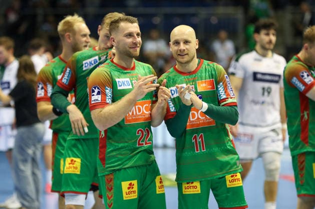 September 23, 2026, xgox, DHB Handball Cup, 2nd Round: SC Magdeburg vs. HSG Wetzlar emspor; from left: Lukas Mertens (Magdeburg), 22; Daniel Pettersson (Magdeburg), 11; celebrating the victory, Celebrations after the game in Magdeburg