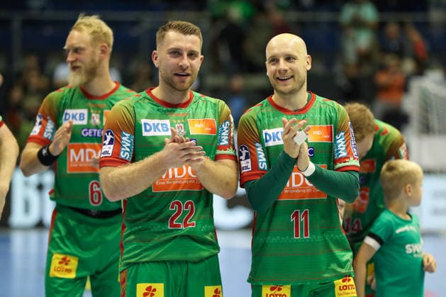 September 23, 2026, xgox, Handball DHB Cup, 2nd Round: SC Magdeburg vs. HSG Wetzlar emspor; from left: Lukas Mertens (Magdeburg), 22; Daniel Pettersson (Magdeburg), 11; celebrating the victory, Celebrations after the game in Magdeburg