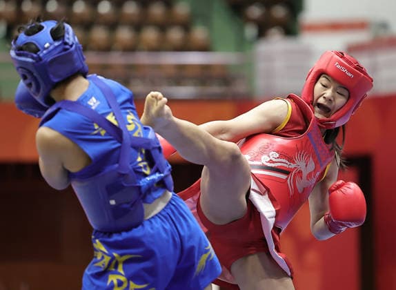 (260924) -- NAGOYA, Sept. 24, 2026 -- Zhang Xiaoyu (R) of China fights with Roshibina Devi Naorem of India during the women s 60kg final of Wushu at the 20th Asian Games Aichi-Nagoya 2026 in Nagoya, Japan, Sept. 24, 2026. ) (SP)JAPAN-NAGOYA-ASIAN GAMES-WUSHU-WOMEN S 60KG FINAL LongxLei 