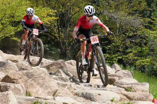 (260924) -- NAGOYA, Sept. 24, 2026 -- Wu Zhifan (R) and Liang Zhenglan of China compete during the women s cross-country final of cycling mountain bike at the 20th Asian Games Aichi-Nagoya 2026 in Nagoya, Japan, Sept. 24, 2026. ) (SP)JAPAN-NAGOYA-ASIAN GAMES-CYCLING MOUNTAIN BIKE-WOMEN S CROSS-COUNTRY FINAL CenxYunpeng 