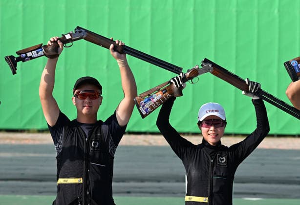 (260924) -- TOYOTA, Sept. 24, 2026 -- Lyu Jianlin (L) and Jiang Yiting of team China celebrate after the Skeet mixed team final of Shooting at the 20th Asian Games Aichi-Nagoya 2026 in Toyota of Aichi Prefecture, Japan, Sept. 24, 2026. ) (SP)JAPAN-TOYOTA-ASIAN GAMES-SHOOTING-SKEET MIXED TEAM-FINAL LiuxLei 