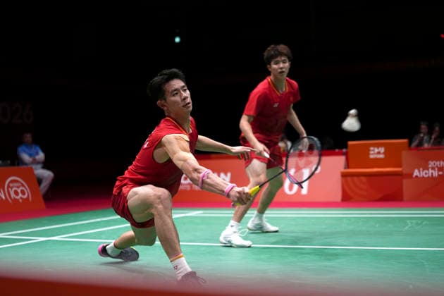 (260924) -- ICHINOMIYA, Sept. 24, 2026 -- He Jiting Liu Yi (L) of China compete against Leo Carnando R. Daniel Marthin of Indonesia during the men s team final of badminton between China and Indonesia at the 20th Asian Games Aichi-Nagoya 2026 in Ichinomiya of Aichi Prefecture, Japan, Sept. 24, 2026. ) (SP)JAPAN-ICHINOMIYA-ASIAN GAMES-BADMINTON-MEN S TEAM LixBo 