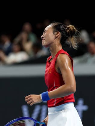 (260924) -- SHENZHEN, Sept. 24, 2026 -- Zheng Qinwen of China reacts after losing a point to Jasmine Paolini of Italy during the quarterfinal match between China and Italy at the 2026 Billie Jean King Cup Finals in Shenzhen, south China s Guangdong Province, Sept. 24, 2026. ) (SP)CHINA-SHENZHEN-TENNIS-BILLIE JEAN KING CUP-CHINA VS ITALY (CN) MaoxSiqian 