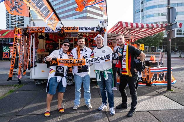 Soccer, Men s, 2026–27 Season, UEFA Nations League League A, Group 2, Matchday 1 in Amsterdam, Netherlands vs. Germany; German fans wearing matchday scarves at a fan shop in front of the stadium, September 24, 2026, Copyright: xMatthiasxKochx