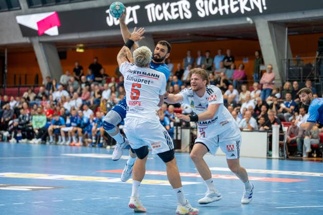 Handball I Men I 2026–2027 Season I DHB Cup I Round 2 I TVB Stuttgart vs. HC Erlangen I September 24, 2026 Mohamed Amine Darmoul 70, TVB Stuttgart with the ball, defended by Marek Nissen 6, HC Erlangen and Maciej Gebala 77, HC Erlangen; Stuttgart, Scharrena, Baden-Württemberg, Germany Copyright: xLobeca MaxxPetershansx