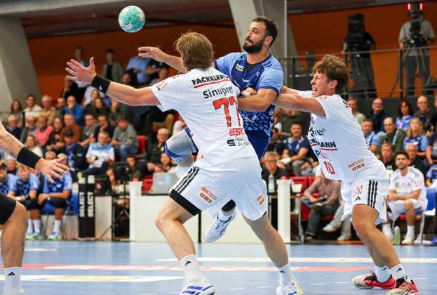September 24, 2026, Germany, Stuttgart, DHB Cup 2026–2027 Season, TVB Stuttgart vs. HC Erlangen, from left: Maciej Gebala (HCE), Dario Sanz de Nicolas (TVB), Florian Scheerer (HCE)