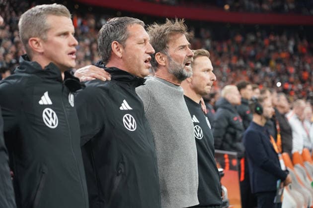 Germany National Team Coach Jürgen Klopp during the national anthem with Assistant Coach Sven Bender, Germany, Assistant Coach Peter Krawietz, Germany, Assistant Coach Pepijn Lijnders, Germany, Amsterdam, September 24, 2026: Netherlands vs. Germany, Nations League Matchday 1, Johan Cruijff Arena