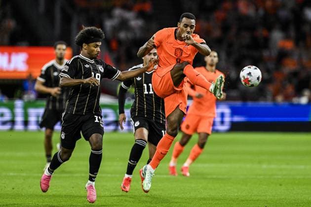 AMSTERDAM - Karim Adeyemi of Germany. Ryan Gravenberch of the Netherlands (lr) during the UEFA Nations League match between the Netherlands and Germany at the Johan Cruijff ArenA on 24 September 2026 in Amsterdam, the Netherlands. ANP OLAF KRAAK UEFA Nations League 2025 26 xVIxANPxSportx xxANPxIVx 569964931 originalFilename: 569964931.jpg