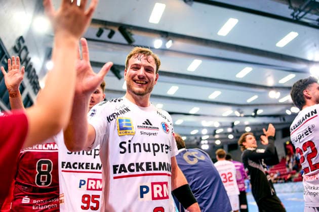 Celebrating with fans, high-fiving fans after the game Frieder Bandlow 2, HC Erlangen, September 24, 2026, Handball, DHB Cup, 2026–2027 Season, Round 2, TVB 1898 Stuttgart vs. HC Erlangen, Nuremberg Metropolitan Region, HCE PeKo xpexkox