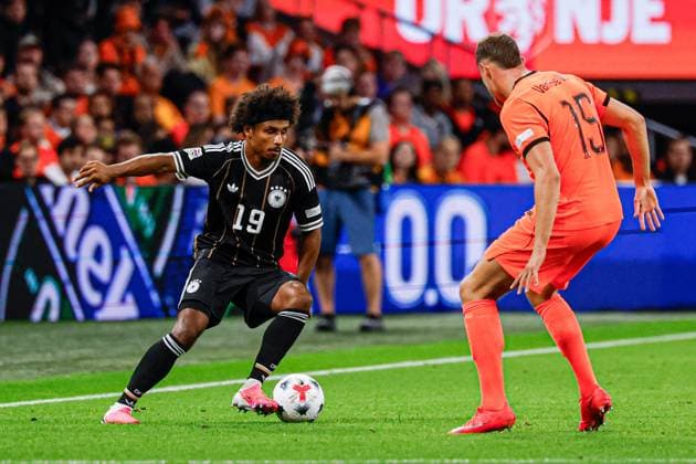 AMSTERDAM - Karim Adeyemi of Germany battles for possession with Micky van de Ven of the Netherlands during the UEFA Nations League match between the Netherlands and Germany at the Johan Cruijff ArenA on 24 September 2026 in Amsterdam, the Netherlands. MARCEL TER BALS ANP UEFA Nations League 2026 27 xVIxANPxSportx xMarcelxterxBalsxIVx 569967213 originalFilename: 569967213.jpg