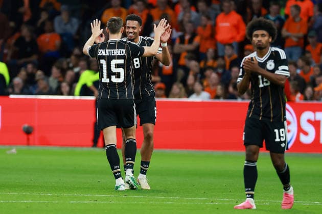 UEFA Nations League Match 26: Netherlands vs. Germany on September 24, 2026, at the Johan Cruyff Arena in Amsterdam; Felix Nmecha (Germany 8) celebrates his goal—making the score 0–1—with Nico Schlotterbeck (Germany 15); in the foreground, Karim Adeyemi (Germany 19) MH