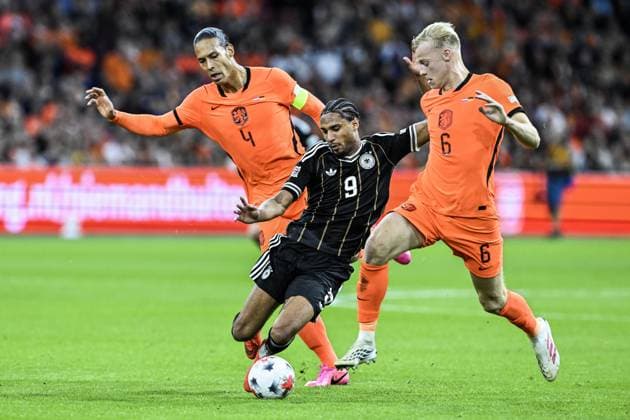 AMSTERDAM - Virgil van Dijk of the Netherlands, Kevin Schade of Germany, Jan Paul van Hecke of the Netherlands (lr) during the UEFA Nations League match between the Netherlands and Germany at the Johan Cruijff ArenA on 24 September 2026 in Amsterdam, the Netherlands. ANP OLAF KRAAK UEFA Nations League 2025 26 xVIxANPxSportx xxANPxIVx 569968072 originalFilename: 569968072.jpg