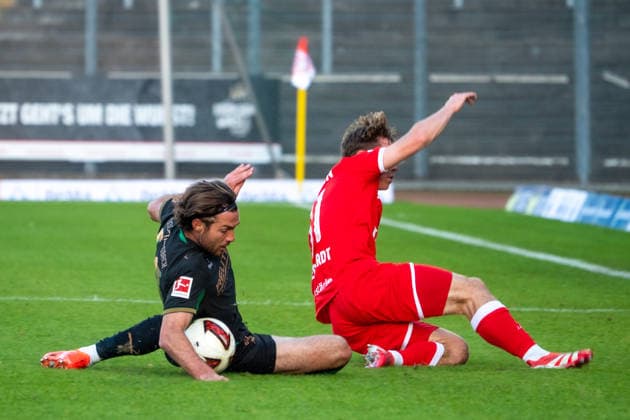 Germany Friendly Match, 2026-2027 Preseason: Sportfreunde Siegen vs. Borussia Mönchengladbach, Thursday, September 24, 2026, Leimbach Stadium, Siegen; Joe Scally (Borussia Mönchengladbach, 29) faces off against Konstantin Gerhardt (Sportfreunde Siegen, 28); Action Siegen, Leimbach Stadium, Germany Copyright: xOrhanxHabashx