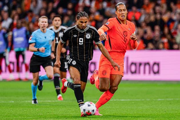 AMSTERDAM - Kevin Schade of Germany battles for possession with Virgil van Dijk of the Netherlands during the UEFA Nations League match between the Netherlands and Germany at the Johan Cruijff ArenA on 24 September 2026 in Amsterdam, the Netherlands. MARCEL TER BALS ANP UEFA Nations League 2026 27 xVIxANPxSportx xMarcelxterxBalsxIVx 569968712 originalFilename: 569968712.jpg