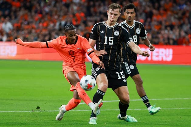 UEFA Nations League Match 26: Netherlands vs. Germany on September 24, 2026, at the Johan Cruyff Arena in Amsterdam; Crysencio Summerville (Netherlands, No. 7) and Nico Schlotterbeck (Germany, No. 15) battle for the ball MH