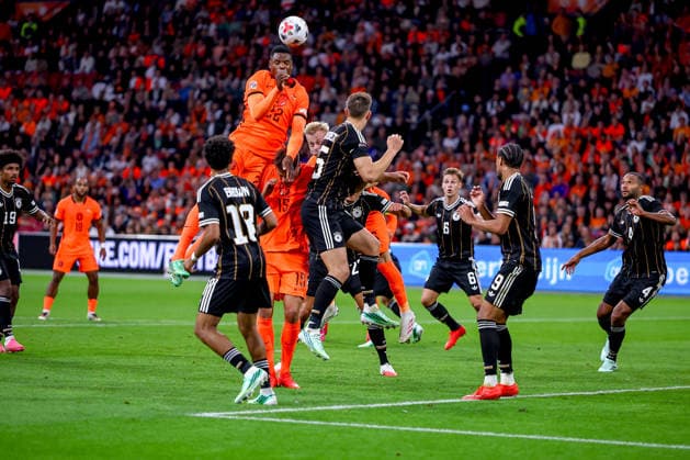 September 24, 2026, Soccer, International Match, Netherlands vs. Germany, Kickoff of the 2026–2027 UEFA Nations League, Matchday 1, Johan Cruijff ArenA, Amsterdam, 2026–27 season. Action in the penalty area: Denzel Dumfries (NED 22) heads the ball in a duel against Nico Schlotterbeck (GER 15). DFB regulations prohibit any use of photographs as image sequences and or quasi-video. Netherlands