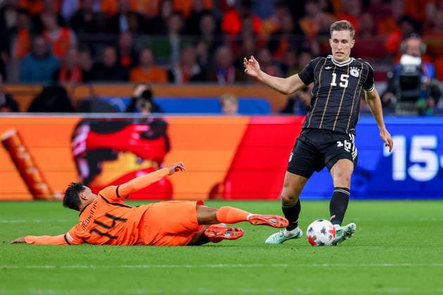 September 24, 2026, Soccer, International Match, Netherlands vs. Germany, Kickoff of the 2026–2027 UEFA Nations League, Matchday 1, Johan Cruijff ArenA, Amsterdam, 2026–27 season: Tijjani Reijnders (NED 14) in a tackle against Nico Schlotterbeck (GER 15). DFB regulations prohibit any use of photographs as image sequences and or quasi-video. Netherlands