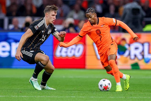 September 24, 2026, Soccer, International Match, Netherlands vs. Germany, Kickoff of the 2026–2027 UEFA Nations League, Matchday 1, Johan Cruijff ArenA, Amsterdam, 2026–27 season: Nico Schlotterbeck (GER 15) in a tackle against Crysencio Summerville (NED 07). DFB regulations prohibit any use of photographs as image sequences and or quasi-video. Netherlands