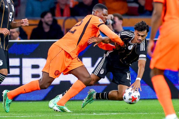 September 24, 2026, Soccer, International Match, Netherlands vs. Germany, Opening Match of the 2026–2027 UEFA Nations League, Matchday 1, Johan Cruijff ArenA, Amsterdam, 2026–27 season: Nathaniel Brown (GER, 18) is knocked to the ground by Denzel Dumfries (NED, 22); shoving, scuffle, commotion. DFB regulations prohibit any use of photographs as image sequences and or quasi-video. Netherlands