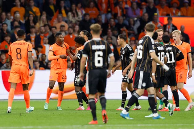 Amsterdam, Netherlands, 24th September 2026. Denzel Dumfries (2nd L) of the Netherlands and Karim Adeyemi (3rd L) of Germany clash during the Netherlands vs Germany UEFA Nations League match at the Johan Cruyff Arena, Amsterdam. Picture credit should read: Cody Froggatt Sportimage EDITORIAL USE ONLY. No use with unauthorised audio, video, data, fixture lists, club league logos or live services. Online in-match use limited to 120 images, no video emulation. No use in betting, games or single club league player publications. SPI_083_CF_NETHERLANDS_V_GERMANY SPI-5017-0083