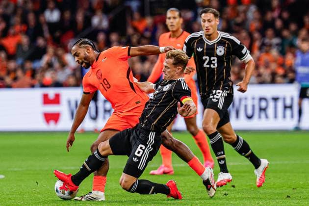 AMSTERDAM - Quinten Timber of the Netherlands battles for possession with Joshua Kimmich of Germany during the UEFA Nations League match between the Netherlands and Germany at the Johan Cruijff ArenA on 24 September 2026 in Amsterdam, the Netherlands. MARCEL TER BALS ANP UEFA Nations League 2026 27 xVIxANPxSportx xMarcelxterxBalsxIVx 569975816 originalFilename: 569975816.jpg