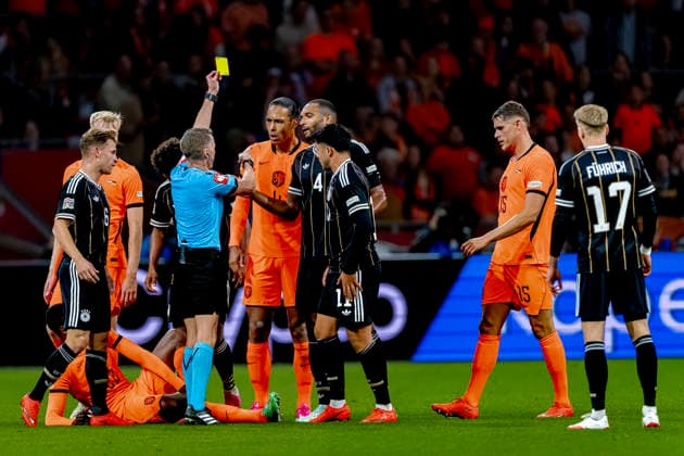 AMSTERDAM: Referee Alejandro Hernandez shows a yellow card to Dutch defender Virgil van Dijk during the UEFA Nations League match between the Netherlands and Germany at the Johan Cruijff ArenA on September 24, 2026, in Amsterdam, the Netherlands. Photo by DeFodi Images