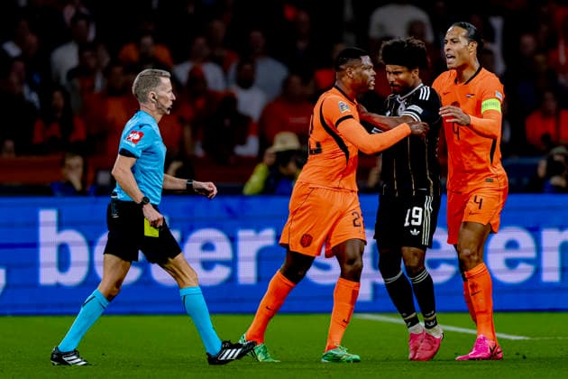 AMSTERDAM: Referee Alejandro Hernandez, Germany midfielder Karim Adeyemi, Netherlands defender Denzel Dumfries, and Netherlands defender Virgil van Dijk during the UEFA Nations League match between the Netherlands and Germany at the Johan Cruijff ArenA on September 24, 2026, in Amsterdam, the Netherlands. Photo by DeFodi Images