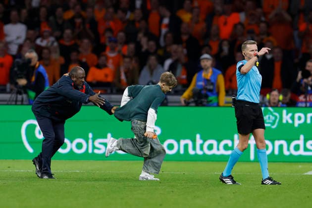Amsterdam, Netherlands, 24th September 2026. A pitch invaded is chased by security during the Netherlands vs Germany UEFA Nations League match at the Johan Cruyff Arena, Amsterdam. Picture credit should read: Cody Froggatt Sportimage EDITORIAL USE ONLY. No use with unauthorised audio, video, data, fixture lists, club league logos or live services. Online in-match use limited to 120 images, no video emulation. No use in betting, games or single club league player publications. SPI_090_CF_NETHERLANDS_V_GERMANY SPI-5017-0090
