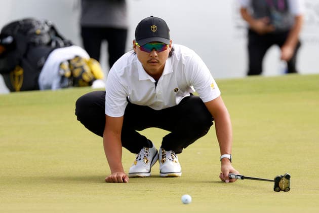MEDINAH, IL - SEPTEMBER 24: Min Woo Lee of Australia squats down to read a putt on No. 15 during the opening four ball session of the Presidents Cup, September 24, 2026, at Medinah Country Club in Medinah, Illinois. (Photo by Matthew Maxey Icon Sportswire) GOLF: SEP 24 Presidents Cup EDITORIAL USE ONLY Icon260924051