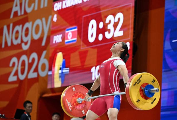 (260925) -- NAGOYA, Sept. 25, 2026 -- Oh Kwang Ok of the Democratic People s Republic of Korea (DPRK) competes during the women s 57kg final of weightlifting at the 20th Asian Games Aichi-Nagoya 2026 in Nagoya, Japan, Sept. 25, 2026. ) (SP)JAPAN-NAGOYA-ASIAN GAMES-WEIGHTLIFTING-WOMEN S 57KG YuxYang 