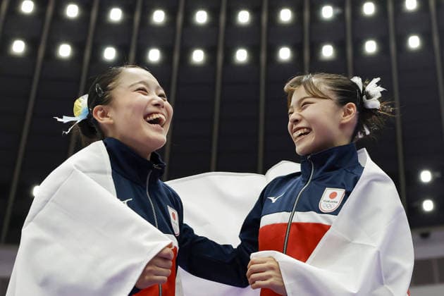Aichi-Nagoya Asian Games: Artistic gymnastics Japan s Aiko Sugihara (R) and Misa Nishiyama celebrate after winning gold and silver, respectively, in the Aichi-Nagoya Asian Games women s artistic gymnastics floor exercise at Nagoya General Gymnasium in Nagoya, central Japan, on Sept. 25, 2026.  A14AA0005628783P