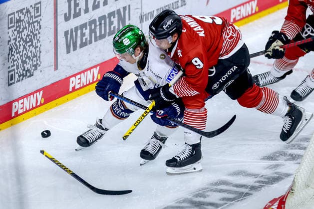 September 25, 2026, Ice hockey, DEL, Kölner Haie vs. Eisbären Berlin, Matchday 3, 2026–27 season, Lanxess Arena, Cologne; Jonas Müller (Eisbären Berlin) 18 in a one-on-one battle against Maximilian Kammerer (Kölner Haie) 09; North Rhine-Westphalia, Germany