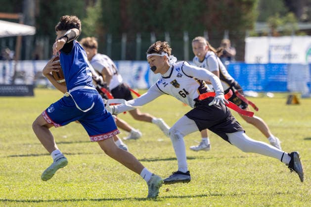 lovakia player runs with the ball and is tackled by german player, U15 Mixed Germany vs Slovakia IFAF European Youth Championships 2026, 24.09.2026 Lido Delle Nazioni Lido Delle Nazioni Italia Copyright: xPFA BjörnxKeckerx