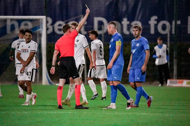 Germany Soccer Season 2026–2027, Regionalliga Southwest, Matchday 9, FC Astoria Walldorf vs. SV Sandhausen, Dietmar Hopp Sportpark, Walldorf; Referee shows a yellow card, Walldorf, Dietmar Hopp Sportpark, Germany Copyright: xBennetxLongx