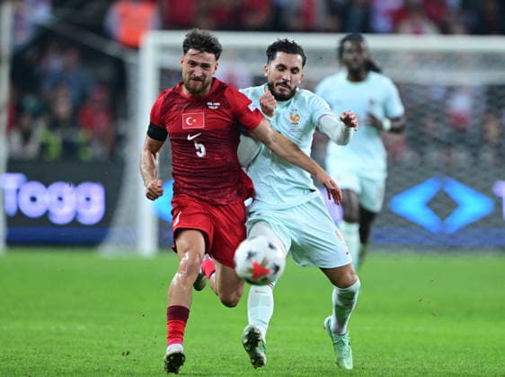 Turkiye v France - UEFA Nations League KOCAELI, TURKIYE - SEPTEMBER 25: Salih Ozcan (5) of Turkiye in action against Rayan Cherki (R) of France during the UEFA Nations League A League Group 1 match between Turkiye and France at Kocaeli Stadium in Kocaeli, Turkiye, on September 25, 2026. Abdulhamid Hosbas Anadolu Kocaeli Turkey. Editorial use only. Please get in touch for any other usage.  Copyright: x2026xAnadoluxAbdulhamidxHosbasx