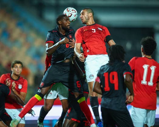 Egypt v Angola at the Africa Cup of Nations Qualifiers 2027 - Group B Ramy RABIA and Kialonda GASPAR during the match between Egypt v Angola at the Africa Cup of Nations Qualifiers KE.TZ.UG 2027 Group B at Cairo International Stadium, Cairo, Egypt Cairo Cairo Egypt Copyright: xMohamedxTageldinx
