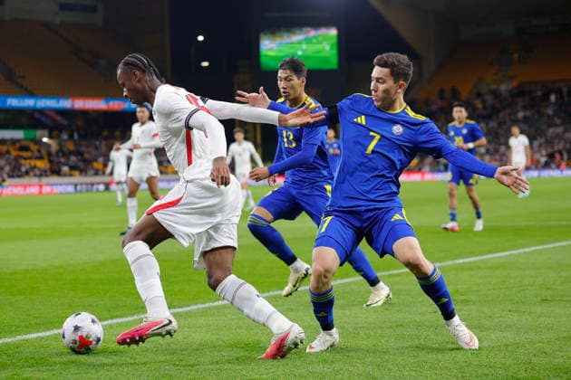 Wolverhampton, England, 25th September 2026. Stephen Mfuni of England U21, U 21 and Abinur Nurymbet of Kazakhstan U21 during the England U21 vs Kazakhstan U21 UEFA European Under-21 Championship Qualifier match at Molineux, Wolverhampton. Picture credit should read: James Baylis Sportimage EDITORIAL USE ONLY. No use with unauthorised audio, video, data, fixture lists, club league logos or live services. Online in-match use limited to 120 images, no video emulation. No use in betting, games or single club league player publications. 156_SPI_JB_U21_ENGLAND_KAZAKHSTAN SPI-5018-0156