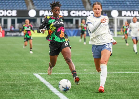 SEATTLE, WA - SEPTEMBER 25: (left to right) Boston Legacy FC forward AÃ¯ssata TraorÃ (14) and Seattle Reign FC defender Jordyn Bugg (23) race of the ball in the first half during the NWSL match between Seattle Reign FC and Boston Legacy FC on September 25, 2026 at Lumen Field in Seattle, Washington. (Photo by Leslie Plaza Johnson Icon Sportswire) SOCCER: SEP 25 NWSL Seattle Reign FC vs Boston Legacy EDITORIAL USE ONLY Icon260925004