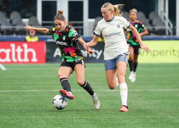 SEATTLE, WA - SEPTEMBER 25: (left to right) Boston Legacy FC midfielder Sarah Schupansky (23) keeps the ball away from Seattle Reign FC forward Maddie Dahlien (5) in the first half during the NWSL match between Seattle Reign FC and Boston Legacy FC on September 25, 2026 at Lumen Field in Seattle, Washington. (Photo by Leslie Plaza Johnson Icon Sportswire) SOCCER: SEP 25 NWSL Seattle Reign FC vs Boston Legacy EDITORIAL USE ONLY Icon260925005