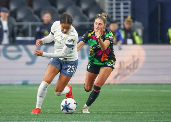 SEATTLE, WA - SEPTEMBER 25: (left to right) Seattle Reign FC defender Jordyn Bugg (23) keeps the ball away from Boston Legacy FC midfielder Sarah Schupansky (23) in the second half during the NWSL match between Seattle Reign FC and Boston Legacy FC on September 25, 2026 at Lumen Field in Seattle, Washington. (Photo by Leslie Plaza Johnson Icon Sportswire) SOCCER: SEP 25 NWSL Seattle Reign FC vs Boston Legacy EDITORIAL USE ONLY Icon260925022