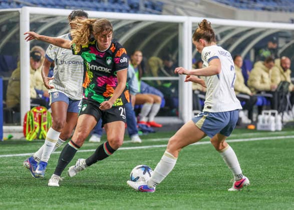 SEATTLE, WA - SEPTEMBER 25: (left to right) Boston Legacy FC defender Nicolette Hernandez (20) and Seattle Reign FC midfielder Maddie Mercado (2) fight for the ball in the second half during the NWSL match between Seattle Reign FC and Boston Legacy FC on September 25, 2026 at Lumen Field in Seattle, Washington. (Photo by Leslie Plaza Johnson Icon Sportswire) SOCCER: SEP 25 NWSL Seattle Reign FC vs Boston Legacy EDITORIAL USE ONLY Icon260925024