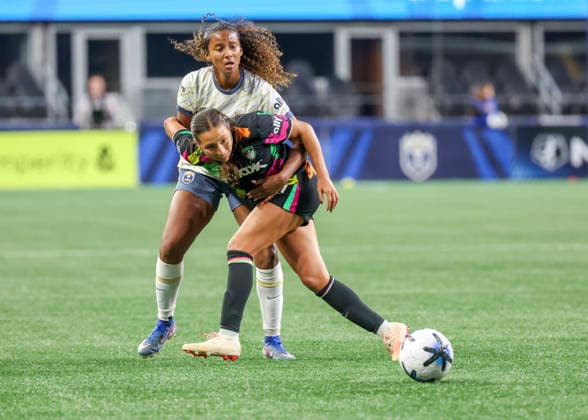 SEATTLE, WA - SEPTEMBER 25: Boston Legacy FC midfielder Barbara Olivieri (21) keeps the ball away from Seattle Reign FC defender Ryanne Brown (22) in the second half during the NWSL match between Seattle Reign FC and Boston Legacy FC on September 25, 2026 at Lumen Field in Seattle, Washington. (Photo by Leslie Plaza Johnson Icon Sportswire) SOCCER: SEP 25 NWSL Seattle Reign FC vs Boston Legacy EDITORIAL USE ONLY Icon260925026
